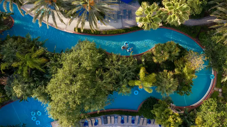 Guests float in a lazy river connected to the resort