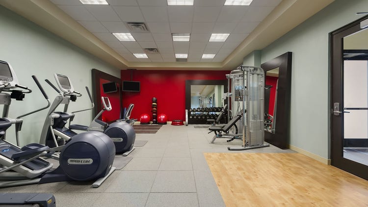 A fitness center with free weights, nautilus equipment and ski and rowing machines.