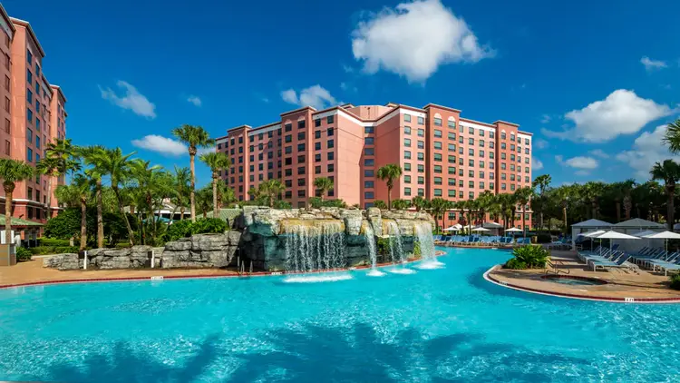 A swimming pool featuring a waterfall at Caribe Royale Orlando, WorldHotels Elite