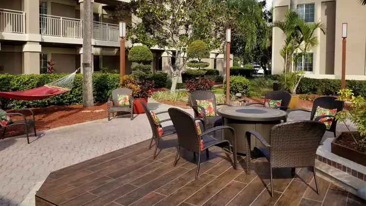 Kick back and take in the well-landscaped grounds in an outdoor seating area.
