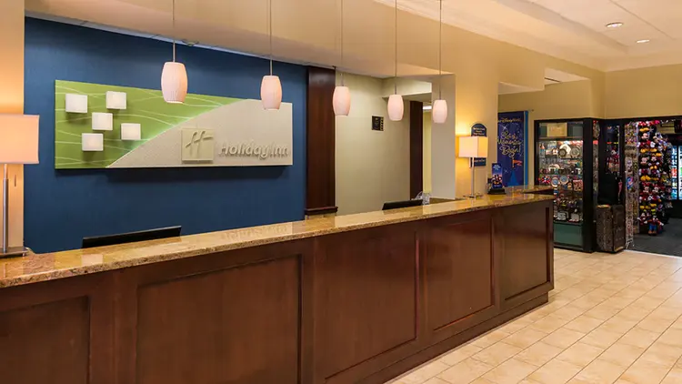 A hotel lobby featuring a long counter