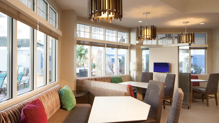 A dining area with tables and chairs