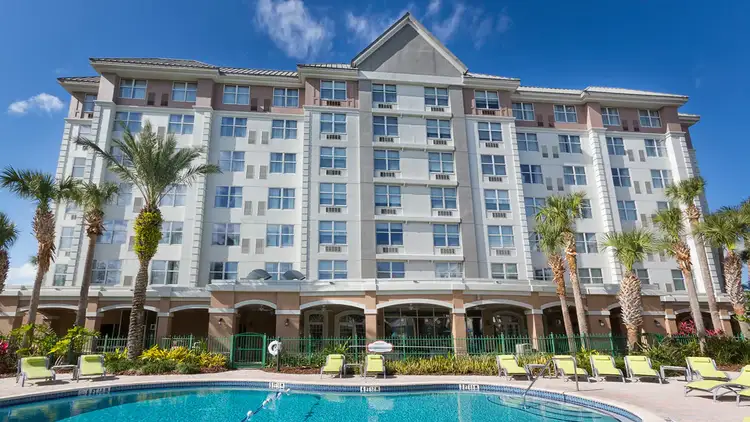 The outside of the hotel during the daytime featuring a swimming pool