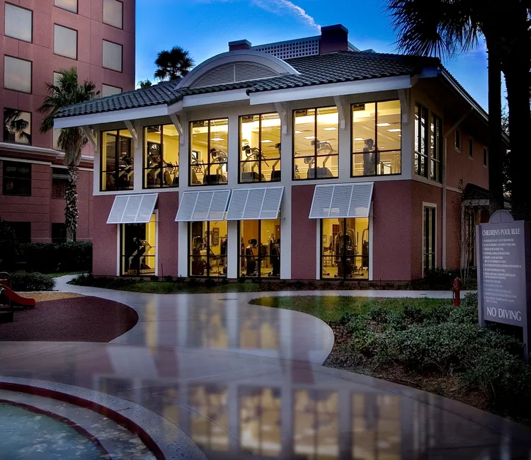 The hotels 2 story fitness center features rows of spin cycles, treadmills and other gym equipment near the windows