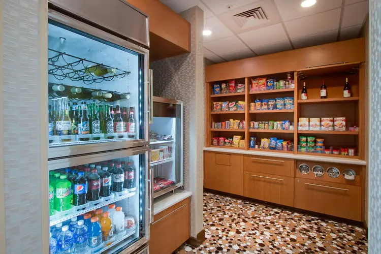 Hotel store with cold sodas, waters and beer, shelves of food and snacks
